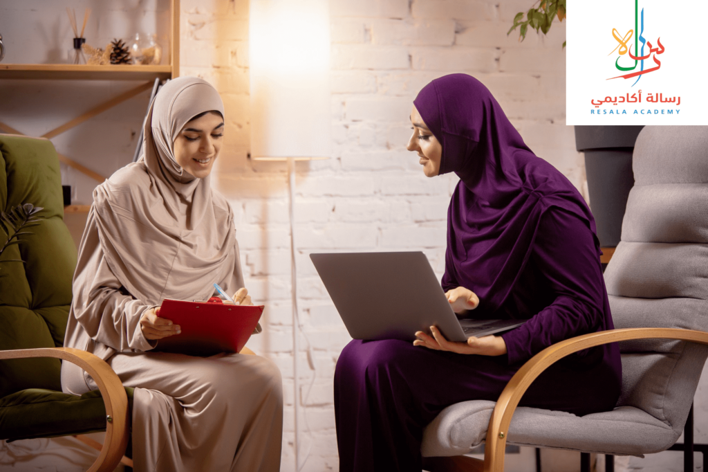 two women study Quran online over their laptop